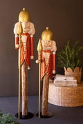 Set of 2 Painted Metal Nutcrackers on Wood Bases — image 1